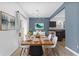Modern dining room boasts stylish lighting and an adjacent kitchen area at 10427 Apple Creek Dr, Indianapolis, IN 46235