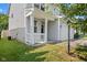 View of home's facade showing a white railed porch and entry door at 10427 Apple Creek Dr, Indianapolis, IN 46235