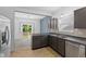 Kitchen featuring stainless steel appliances, stylish backsplash, and sliding doors to yard at 10427 Apple Creek Dr, Indianapolis, IN 46235