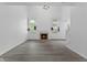 Bright, open living room with a fireplace and modern flooring at 10427 Apple Creek Dr, Indianapolis, IN 46235