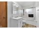 Bathroom featuring a single sink vanity and shower-tub combo with sliding glass doors at 10965 W Base Line Rd, Jamestown, IN 46147