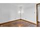 A cozy bedroom with hardwood floors, featuring a modern lamp for ambient lighting at 10965 W Base Line Rd, Jamestown, IN 46147