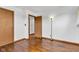 Empty bedroom showcasing hardwood floors, a closet, an open door, and lamp at 10965 W Base Line Rd, Jamestown, IN 46147