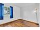 This bedroom has hardwood floors, bright walls, and a window with a view of the outdoors at 10965 W Base Line Rd, Jamestown, IN 46147
