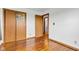 Bedroom featuring hardwood floors, closet, and bathroom access at 10965 W Base Line Rd, Jamestown, IN 46147