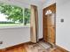 Bright entryway with a wood front door, decorative window, and a view of the outdoors at 10965 W Base Line Rd, Jamestown, IN 46147