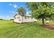 Side exterior of home with mature trees, white trim, siding and blue skies at 10965 W Base Line Rd, Jamestown, IN 46147