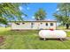 Exterior of home shows siding, white trim, a white door and an above ground propane tank at 10965 W Base Line Rd, Jamestown, IN 46147
