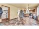 Open kitchen layout with appliances, wood cabinets, and laundry closet at 10965 W Base Line Rd, Jamestown, IN 46147