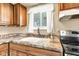 Close-up shot of kitchen sink and faucet with countertops and cabinets at 10965 W Base Line Rd, Jamestown, IN 46147