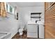 Bright laundry room with modern washer, dryer, and white walls at 10965 W Base Line Rd, Jamestown, IN 46147
