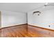 Minimalist living room with hardwood floors and neutral wall color, offering versatile styling options at 10965 W Base Line Rd, Jamestown, IN 46147