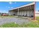 Open metal outbuilding, ideal for storage or workshop space, enhancing the property's functionality at 10965 W Base Line Rd, Jamestown, IN 46147