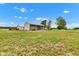 Scenic property showcasing outbuildings, ideal for storage, hobbies, and workspace at 10965 W Base Line Rd, Jamestown, IN 46147
