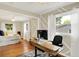 Bedroom featuring hardwood floors, plenty of natural light, and open views to an office with an adjustable desk at 12606 Markay Dr, Fishers, IN 46038