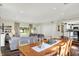 Spacious living room and dining area featuring hardwood floors, natural light, and an open layout to the kitchen at 12606 Markay Dr, Fishers, IN 46038
