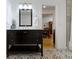 Stylish bathroom featuring a dark vanity, patterned floors, and modern fixtures at 134 N Elder Ave, Indianapolis, IN 46222