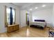 Well-lit bedroom with hardwood floors, large windows with curtains, and ample space at 134 N Elder Ave, Indianapolis, IN 46222