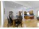 Inviting dining area with a long black table and a kitchen view at 134 N Elder Ave, Indianapolis, IN 46222