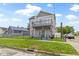 Beautiful two-story home featuring a charming balcony and a well-manicured front lawn at 134 N Elder Ave, Indianapolis, IN 46222