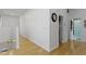 Hallway with hardwood floors and access to various rooms at 134 N Elder Ave, Indianapolis, IN 46222