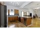 Open kitchen with granite countertops, stainless appliances, and a wine cooler at 134 N Elder Ave, Indianapolis, IN 46222