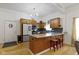 Modern kitchen features granite counters, stainless appliances, and an island at 134 N Elder Ave, Indianapolis, IN 46222