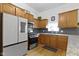 Updated kitchen featuring granite countertops and stainless steel appliances at 134 N Elder Ave, Indianapolis, IN 46222