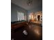 Spacious living room with hardwood floors, pool table and ample natural light at 1354 Edgemont Ave, Indianapolis, IN 46208