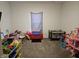 Versatile bedroom space, perfect as a playroom or guest room, featuring ample natural light and open space at 1439 Silver Pine Ln, Sheridan, IN 46069