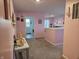 Bright pink hallway leads to various rooms, featuring decorative accents and plenty of natural light at 1439 Silver Pine Ln, Sheridan, IN 46069