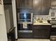 Modern kitchen equipped with built-in microwave, oven and sleek countertops, perfect for culinary adventures at 1439 Silver Pine Ln, Sheridan, IN 46069