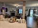 Spacious living area with a cozy fireplace, and an adjacent dining space, perfect for gatherings at 1439 Silver Pine Ln, Sheridan, IN 46069