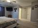 Large carpeted bedroom with an ensuite bathroom, ceiling fan, and a comfortable bed at 1439 Silver Pine Ln, Sheridan, IN 46069