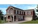 Charming two-story home with a covered front porch, gabled roof, and attached two-car garage at 15934 Meadow Frost Ct, Fishers, IN 46037