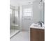 Stylish bathroom featuring double sinks, white countertops, and a glass shower at 15946 Meadow Frost Ct, Fishers, IN 46037