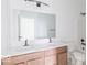 Bathroom featuring double sinks, white countertops, and a bathtub at 15946 Meadow Frost Ct, Fishers, IN 46037