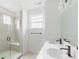 Stylish bathroom featuring double sinks, white countertops, and a glass shower at 15946 Meadow Frost Ct, Fishers, IN 46037