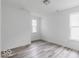Bright bedroom featuring modern gray flooring and sunlit windows at 15946 Meadow Frost Ct, Fishers, IN 46037