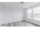 Bedroom featuring gray vinyl flooring, natural light, and neutral colored walls at 15946 Meadow Frost Ct, Fishers, IN 46037