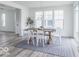 Bright dining room with table and chairs, view to the outdoors and neighborhood at 15946 Meadow Frost Ct, Fishers, IN 46037