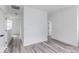 Hallway featuring modern gray flooring, white trim and neutral colored walls at 15946 Meadow Frost Ct, Fishers, IN 46037