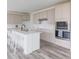 Modern kitchen with a center island, stainless steel appliances, and white countertops at 15946 Meadow Frost Ct, Fishers, IN 46037