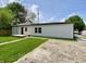 View of the home's backyard, grass, and patio at 1649 N Arsenal Ave, Indianapolis, IN 46218