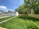 Backyard featuring a large yard, garage, and privacy fence at 1649 N Arsenal Ave, Indianapolis, IN 46218