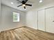 Bright bedroom with wood floors, closet and large window at 1649 N Arsenal Ave, Indianapolis, IN 46218