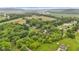 Wide aerial shot of lush acreage featuring scattered homes and mature trees at 1805 Center Valley Rd, Martinsville, IN 46151