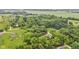 Birds eye view of land featuring a home, lush trees, green space and a graveled road at 1805 Center Valley Rd, Martinsville, IN 46151