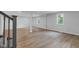 Spacious basement with light gray walls, vinyl plank flooring, and natural light from windows at 1805 Center Valley Rd, Martinsville, IN 46151