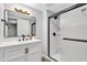 Updated bathroom featuring a large mirror, contemporary lighting, and tiled shower stall at 1805 Center Valley Rd, Martinsville, IN 46151